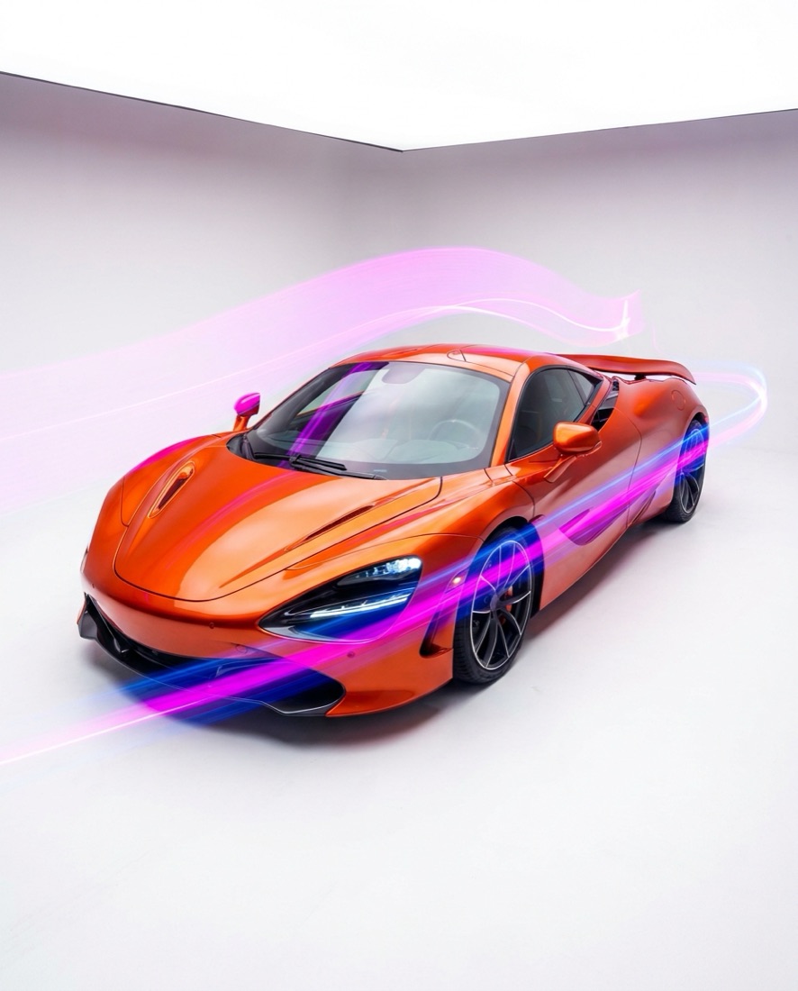 Automotive campaign visual — orange sports car with light streaks